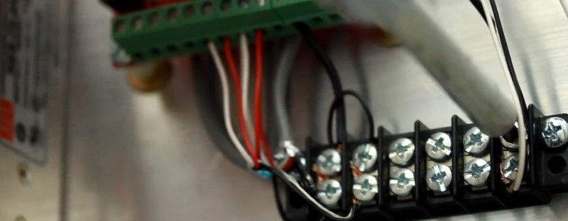 The black wire and other wires including the shielding is connected to the 24V ground terminal strip